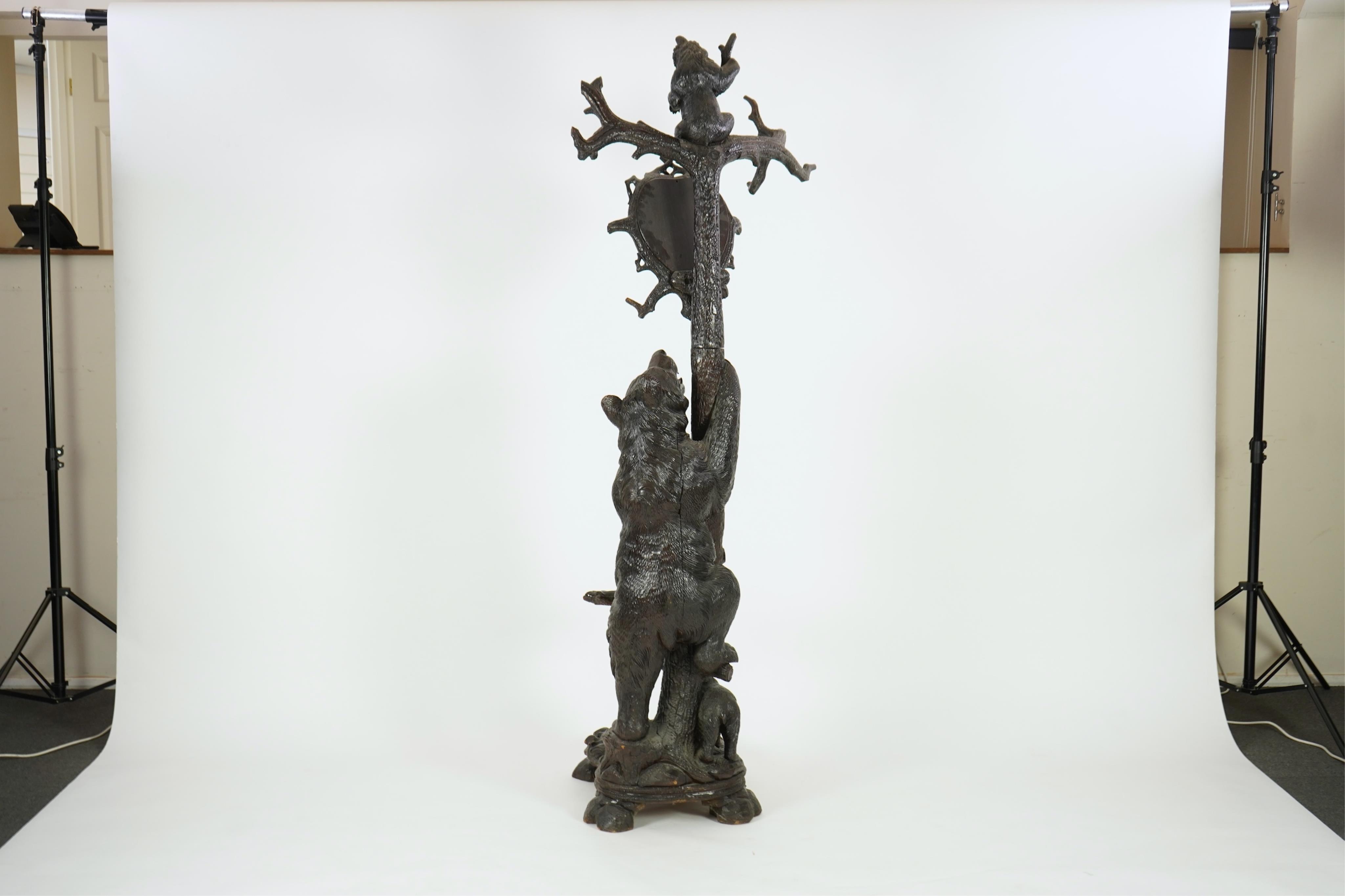 A late 19th century Black forest carved bear hallstand